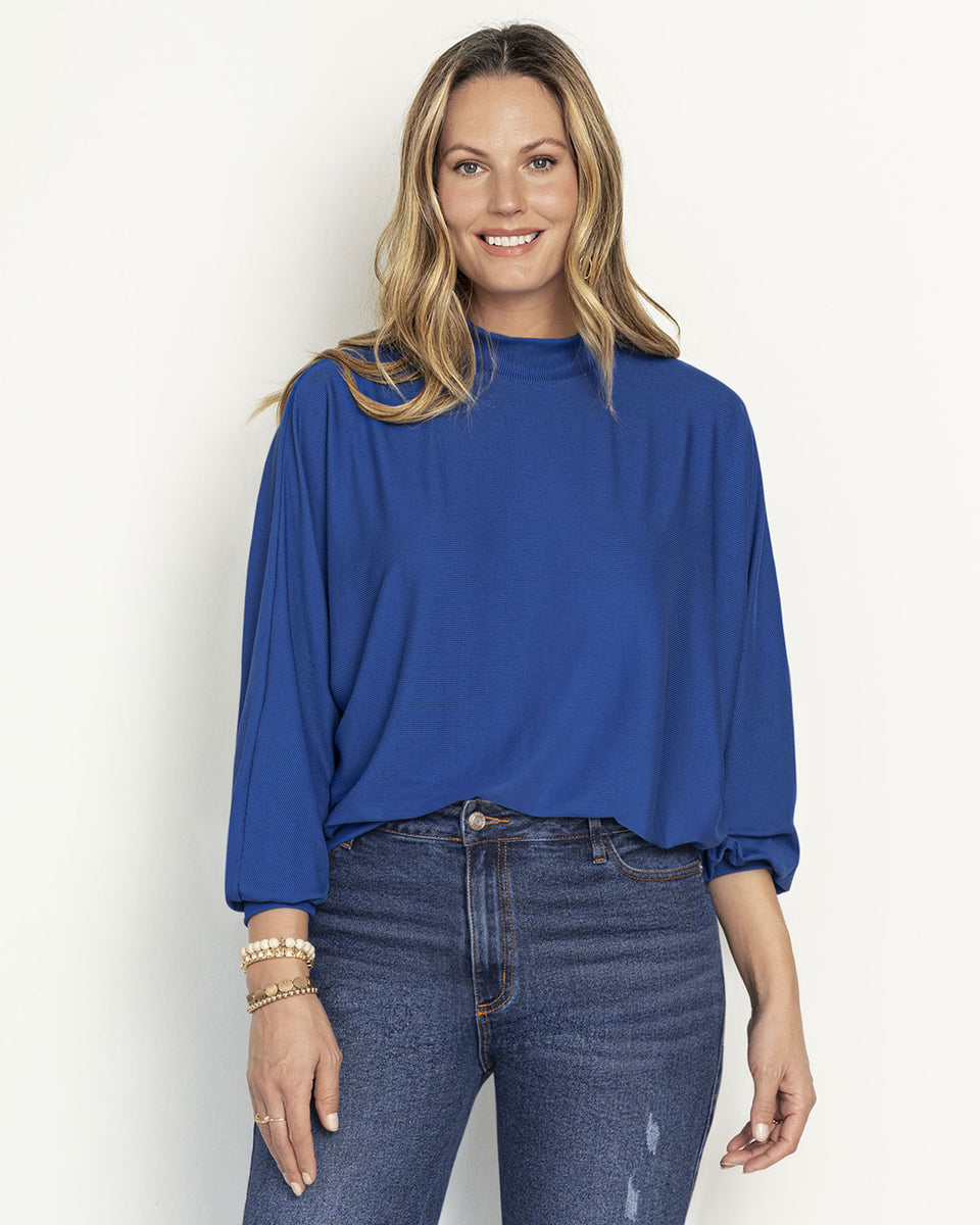 Polerón cuello alto con mangas con volumen