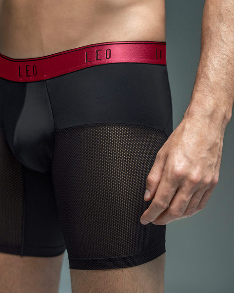 boxer-medio-de-secado-rapido-con-mallas-transpirables-en-microfibra#color_b15-negro-con-elastico-rojo