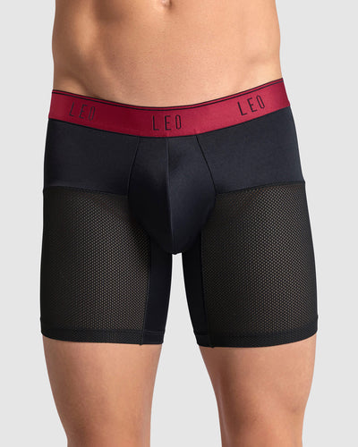 boxer-medio-de-secado-rapido-con-mallas-transpirables-en-microfibra#color_b15-negro-con-elastico-rojo