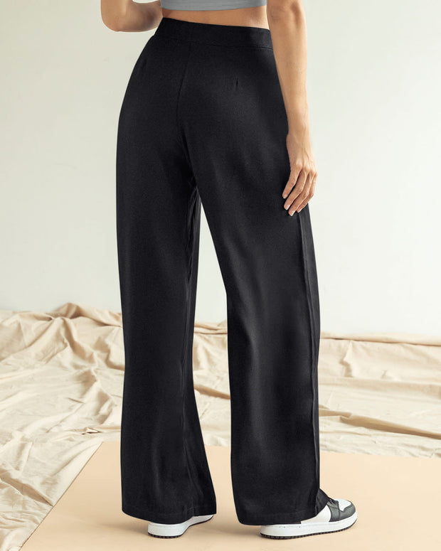 pantalon-tiro-alto-con-prenses-en-frente-y-pretina-funcional#color_700-negro