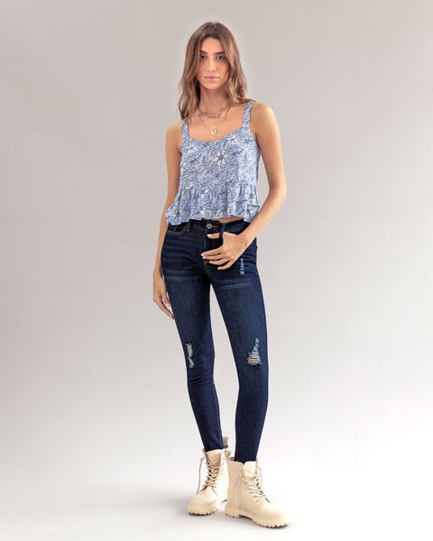 Jean skinny tiro medio con detalles desgastados#color_052-azul-medio